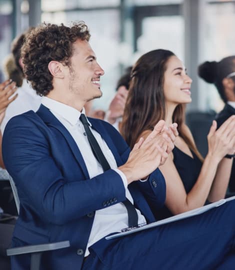 conference guests applaud
