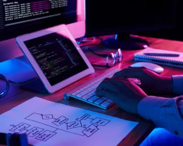 close-up image programer is working at his desk-office