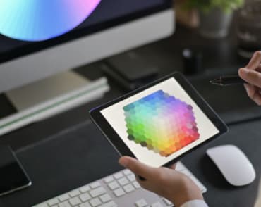 close-up image creative web designer is working with color selection graphic tablet